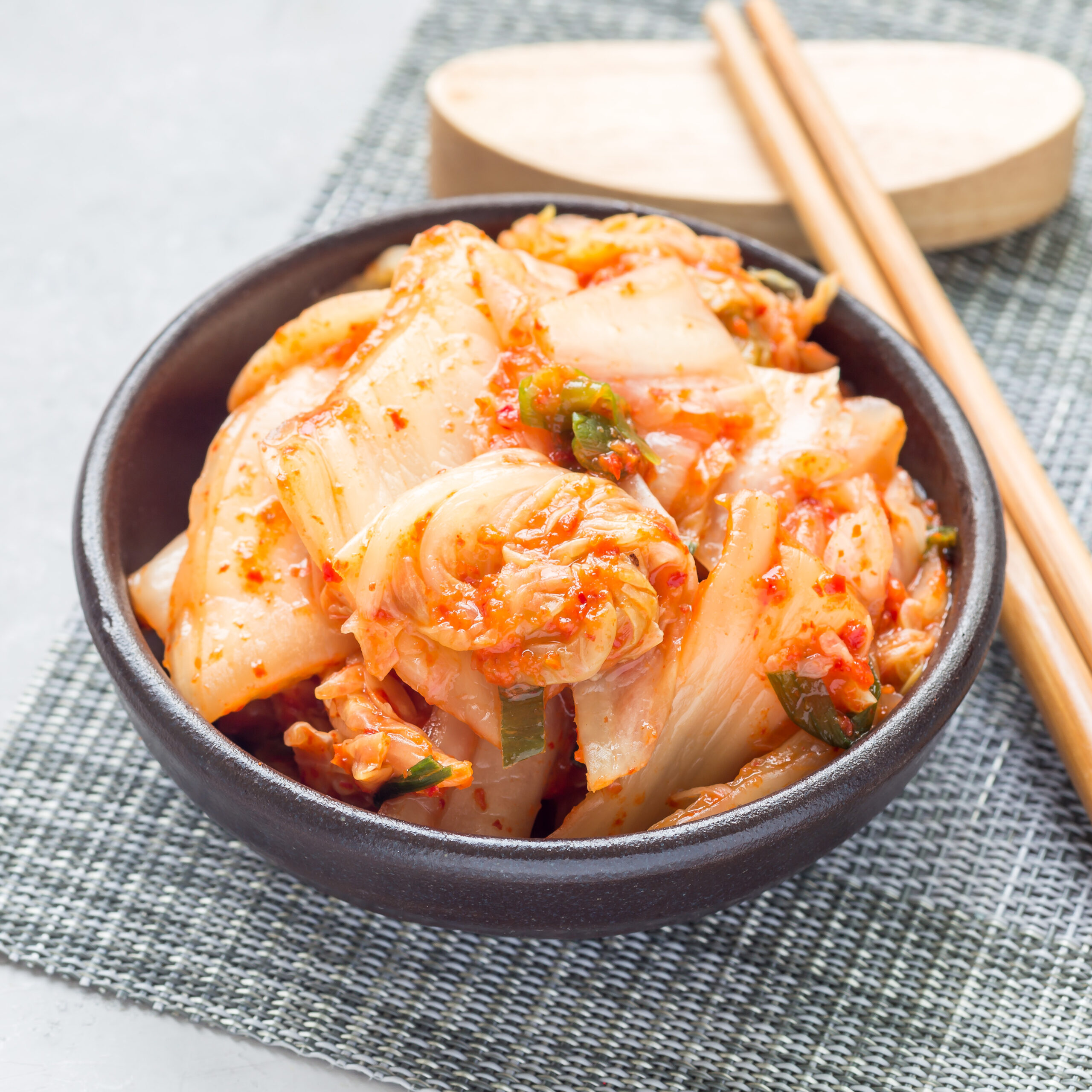 Kimchi cabbage. Korean appetizer in a ceramic bowl.